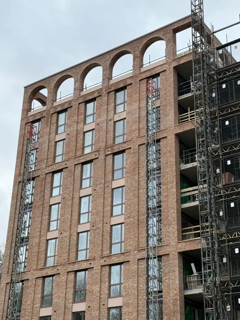brick arch lintels lining roof of apartments london